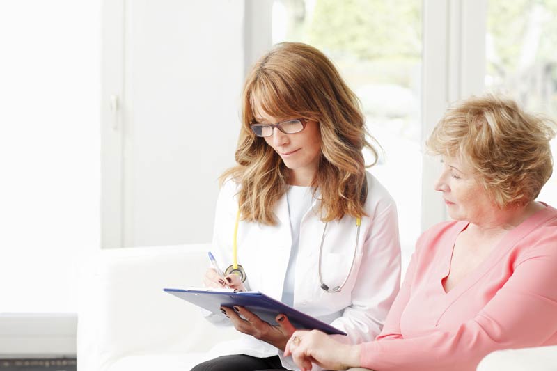 Patient taking notes while planning their care